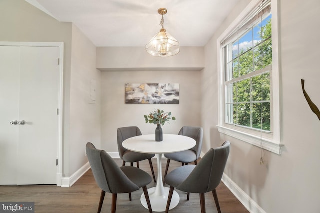 2507 Arlington Blvd Unit 20, Arlington, VA 22201 - dining room featuring baseboards, wood finished floors, and a chandelier