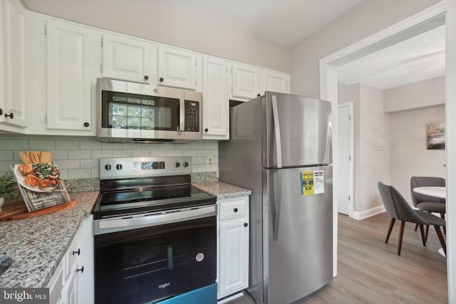 2507 Arlington Blvd Unit 20, Arlington, VA 22201 - kitchen featuring white cabinetry, stainless steel appliances, and backsplash