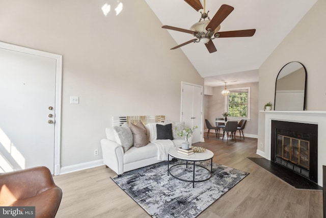 2507 Arlington Blvd Unit 20, Arlington, VA 22201 - living room featuring ceiling fan with notable chandelier, baseboards, and wood finished floors