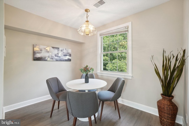 2507 Arlington Blvd Unit 20, Arlington, VA 22201 - dining room with baseboards, dark wood-style floors, visible vents, and a chandelier