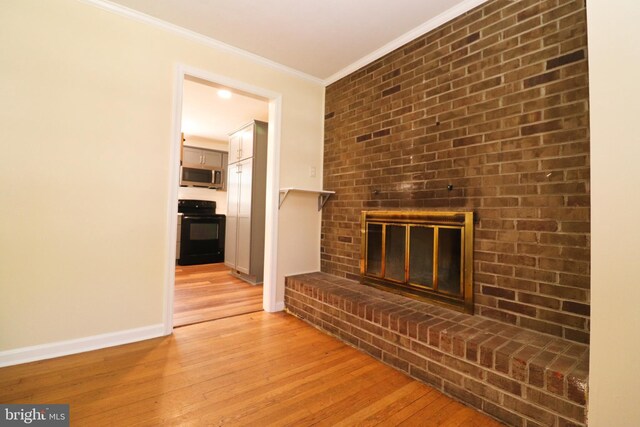 1405 Westchester St, Salisbury, MD 21801 - unfurnished living room with light wood-type flooring, a fireplace, baseboards, and ornamental molding