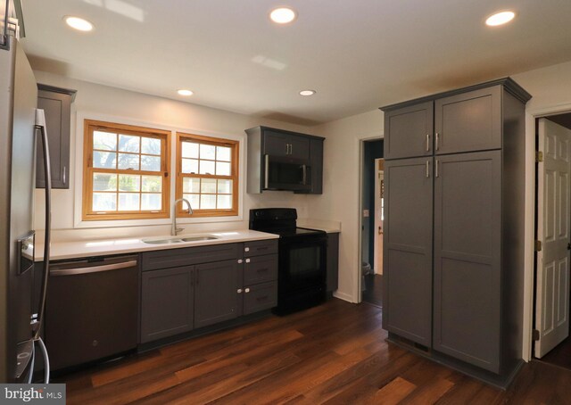 1405 Westchester St, Salisbury, MD 21801 - kitchen featuring appliances with stainless steel finishes, light countertops, a sink, gray cabinetry, and dark wood-style floors