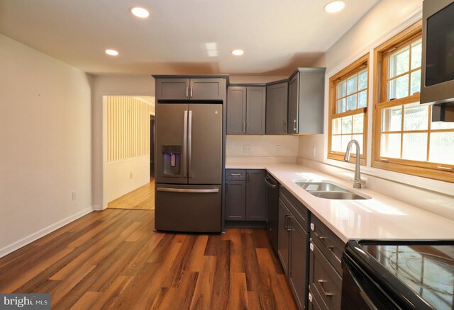 1405 Westchester St, Salisbury, MD 21801 - kitchen with dark wood finished floors, recessed lighting, light countertops, a sink, and stainless steel appliances
