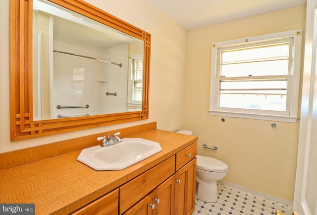 1405 Westchester St, Salisbury, MD 21801 - full bathroom with baseboards, toilet, vanity, and a shower