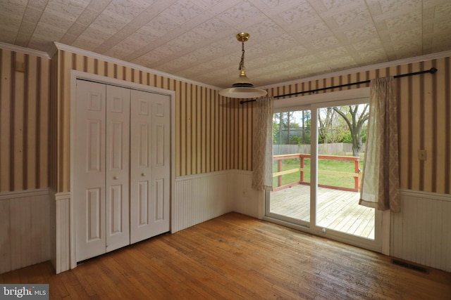 1405 Westchester St, Salisbury, MD 21801 - unfurnished bedroom with crown molding, a wainscoted wall, wood-type flooring, access to outside, and visible vents