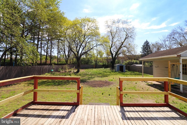 1405 Westchester St, Salisbury, MD 21801 - deck with a yard, an outdoor structure, a fenced backyard, and a storage shed