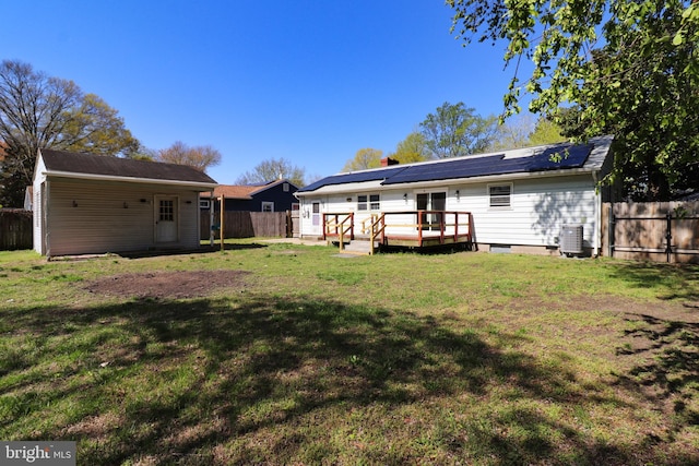 1405 Westchester St, Salisbury, MD 21801 - back of house featuring a yard, a fenced backyard, a wooden deck, and central air condition unit