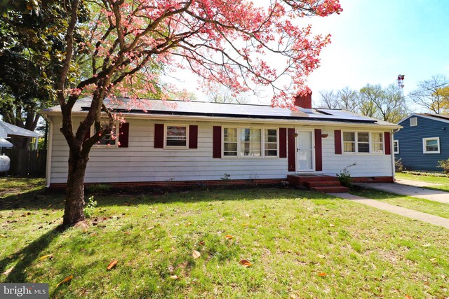 1405 Westchester St, Salisbury, MD 21801 - ranch-style house featuring a chimney, solar panels, and a front lawn