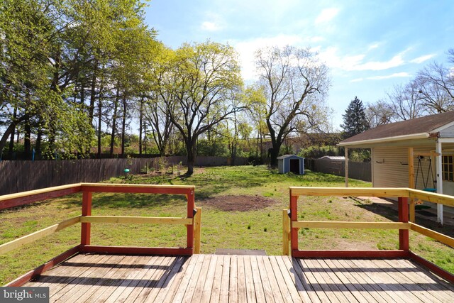 1405 Westchester St, Salisbury, MD 21801 - deck with a yard, an outdoor structure, a fenced backyard, and a storage shed
