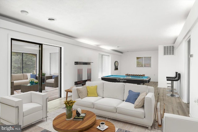 living room with billiards and light wood-type flooring