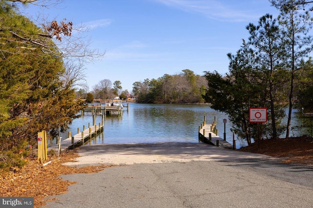 dock featuring a boat ramp and a water view
