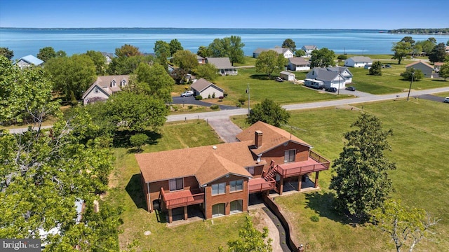 aerial perspective of suburban area featuring a large body of water