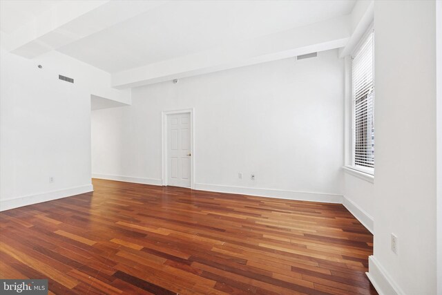 1500 Chestnut St Unit 15H, Philadelphia, PA 19102 - spare room with visible vents, baseboards, and hardwood / wood-style flooring