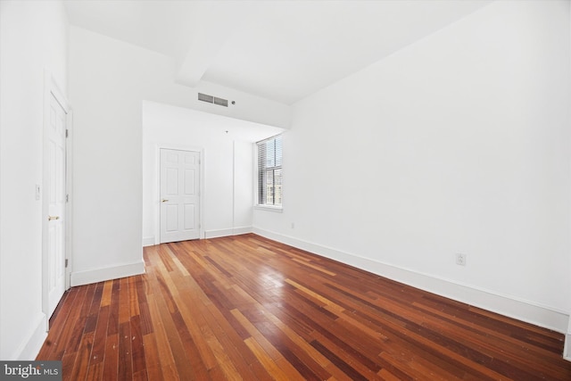 1500 Chestnut St Unit 15H, Philadelphia, PA 19102 - empty room featuring beamed ceiling, baseboards, visible vents, and hardwood / wood-style flooring