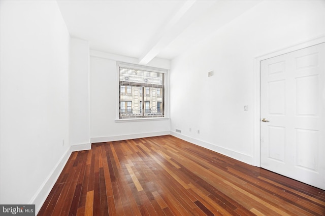 1500 Chestnut St Unit 15H, Philadelphia, PA 19102 - empty room featuring beamed ceiling, baseboards, and hardwood / wood-style flooring