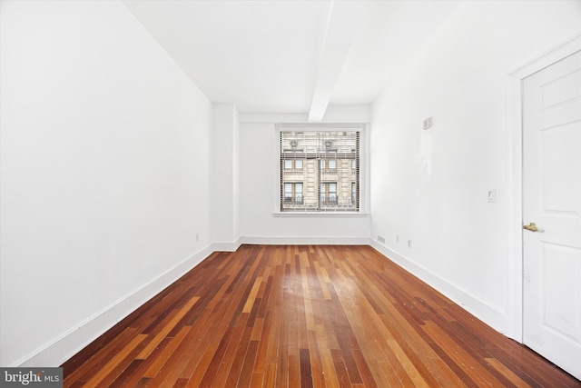 1500 Chestnut St Unit 15H, Philadelphia, PA 19102 - spare room featuring hardwood / wood-style floors, baseboards, and beam ceiling