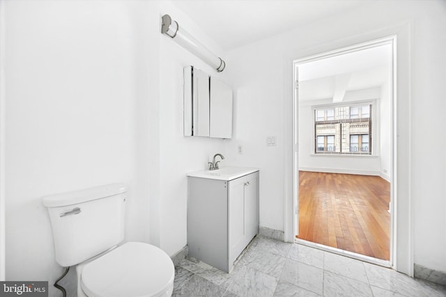 1500 Chestnut St Unit 15H, Philadelphia, PA 19102 - bathroom featuring vanity, marble finish floor, baseboards, and toilet