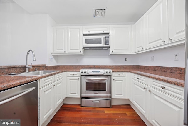 1500 Chestnut St Unit 15H, Philadelphia, PA 19102 - kitchen featuring stainless steel appliances, visible vents, white cabinetry, and a sink