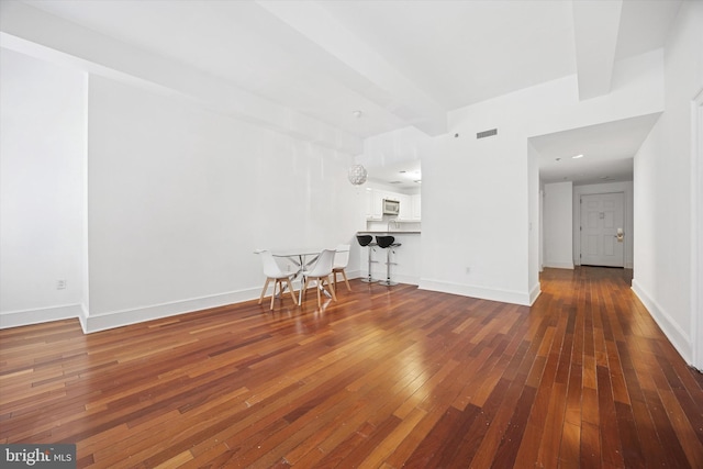 1500 Chestnut St Unit 15H, Philadelphia, PA 19102 - unfurnished living room with hardwood / wood-style floors, baseboards, and visible vents