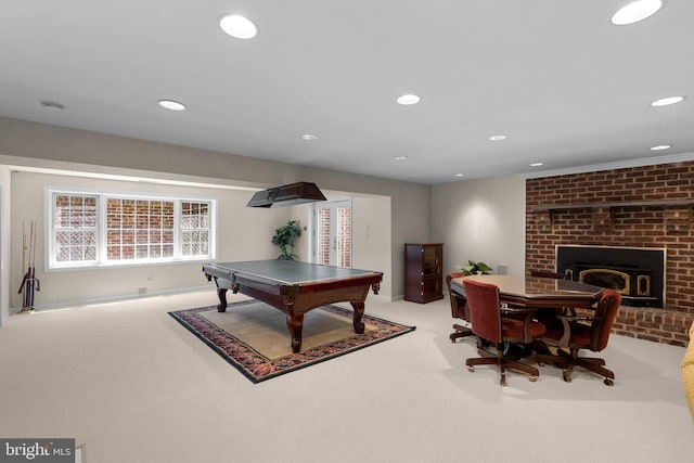 rec room with carpet floors, recessed lighting, and a brick fireplace