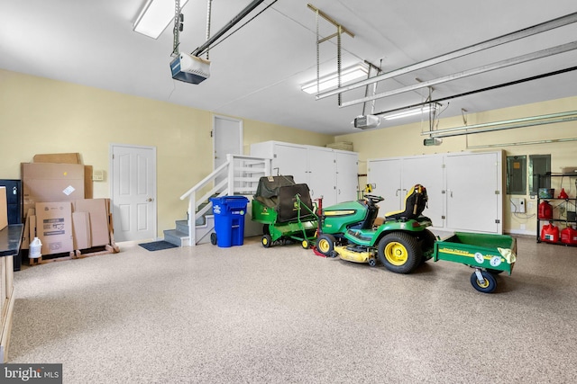 garage featuring a garage door opener and electric panel