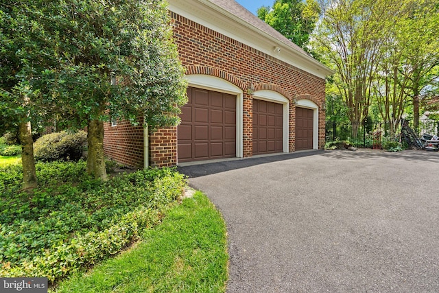garage featuring driveway