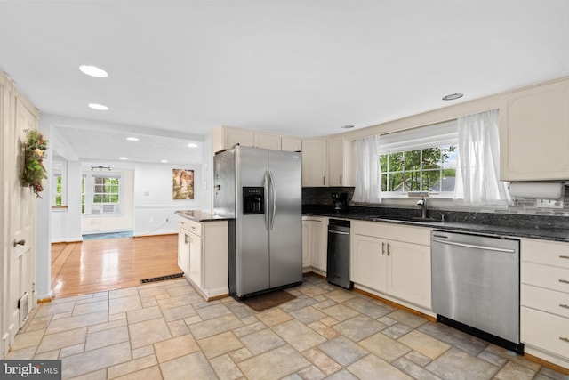 669 Dicks Hollow Rd, Winchester, VA 22603 - kitchen featuring appliances with stainless steel finishes, a sink, plenty of natural light, cream cabinetry, and recessed lighting