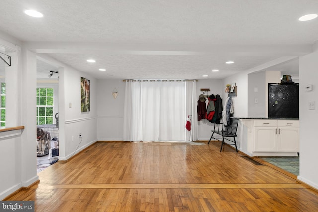 669 Dicks Hollow Rd, Winchester, VA 22603 - unfurnished living room featuring light wood finished floors, baseboards, and recessed lighting
