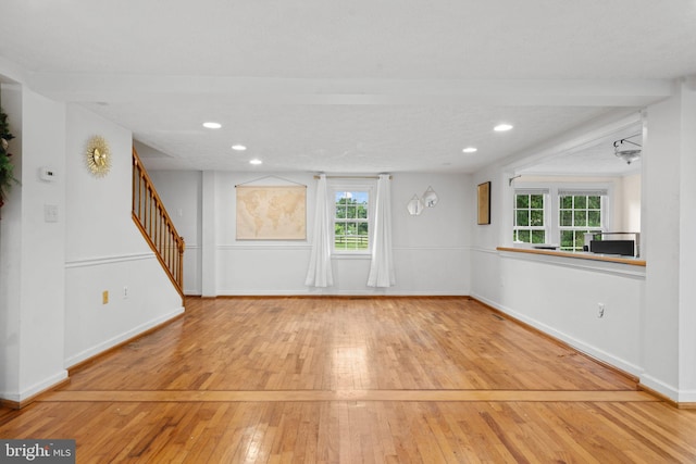 669 Dicks Hollow Rd, Winchester, VA 22603 - unfurnished living room with hardwood / wood-style floors, plenty of natural light, stairway, recessed lighting, and baseboards