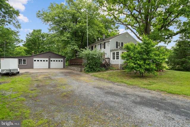 669 Dicks Hollow Rd, Winchester, VA 22603 - view of home's exterior featuring an outbuilding, a garage, a deck, a lawn, and view of scattered trees