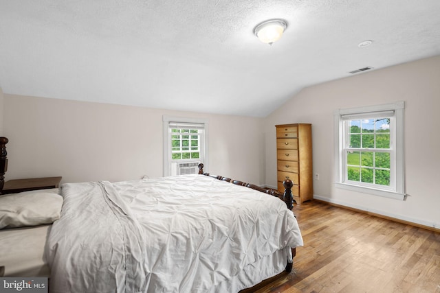 669 Dicks Hollow Rd, Winchester, VA 22603 - bedroom featuring lofted ceiling, light wood-type flooring, and baseboards