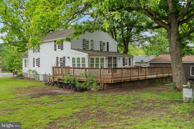 669 Dicks Hollow Rd, Winchester, VA 22603 - rear view of house with a wooden deck, a lawn, and central air condition unit
