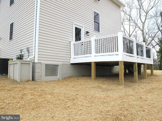 back of property with a wooden deck