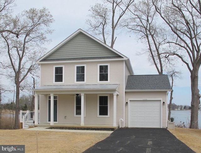 view of front of property with a shingled roof, a porch, an attached garage, and aphalt driveway