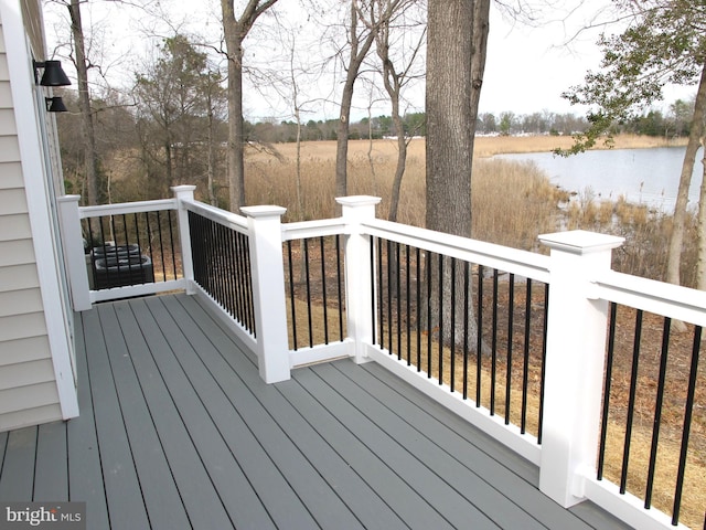 wooden deck with a water view