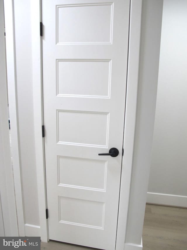 details with baseboards and wood finished floors