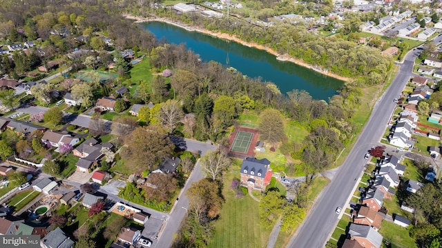 drone / aerial view with a residential view and a water view
