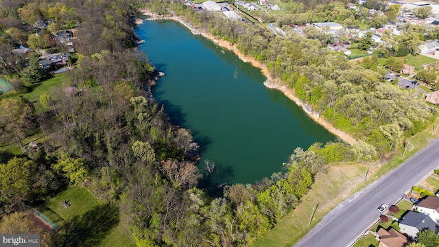 birds eye view of property with a residential view and a water view