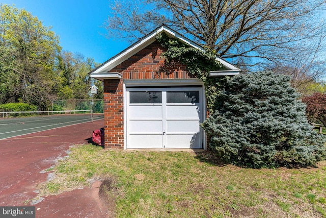 garage featuring fence