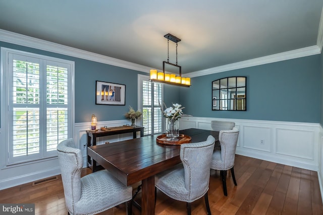 875 Brintons Bridge Rd, West Chester, PA 19382 - dining space with visible vents, ornamental molding, dark wood-type flooring, and a wainscoted wall