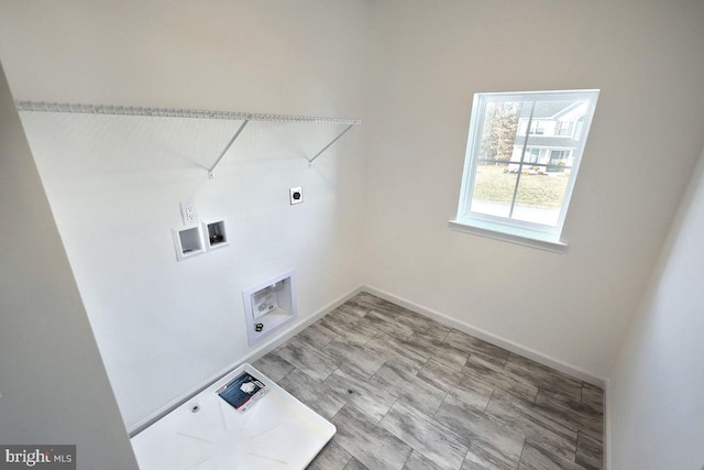 laundry room with baseboards, electric dryer hookup, laundry area, and washer hookup