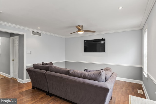 living area with wood finished floors, ceiling fan, and visible vents