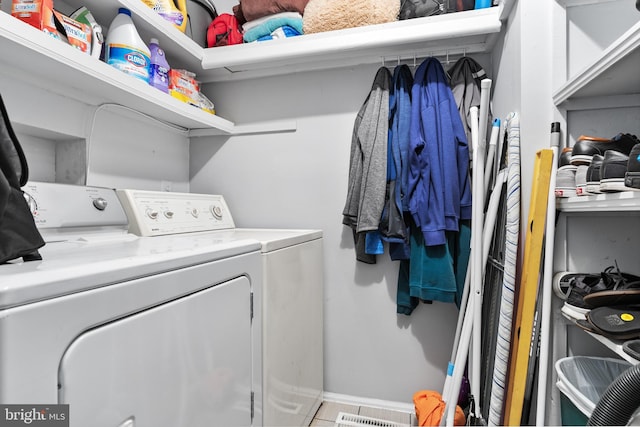 laundry room featuring independent washer and dryer and laundry area