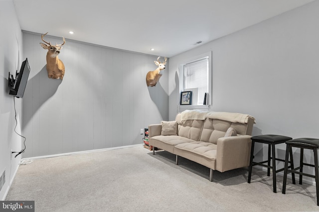 sitting room with carpet flooring, visible vents, and recessed lighting