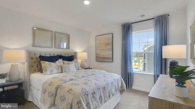 bedroom featuring carpet flooring, baseboards, and visible vents