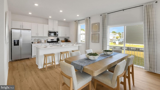 dining room featuring light wood-style floors and recessed lighting