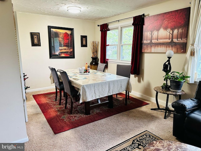 6112 Armor Dr, Clinton, MD 20735 - dining area with carpet flooring, baseboards, and a textured ceiling