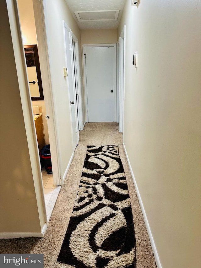 6112 Armor Dr, Clinton, MD 20735 - corridor with light carpet, attic access, and baseboards