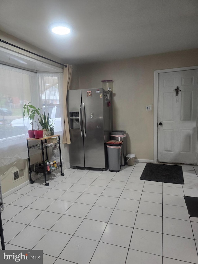 6112 Armor Dr, Clinton, MD 20735 - kitchen with stainless steel fridge with ice dispenser, baseboards, and light tile patterned floors