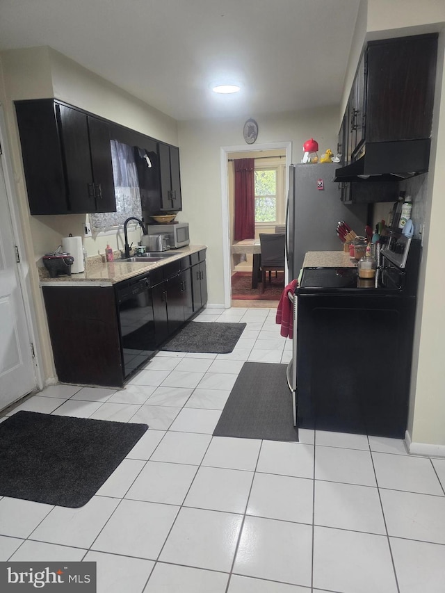 6112 Armor Dr, Clinton, MD 20735 - kitchen with electric stove, black dishwasher, dark cabinetry, a sink, and light countertops
